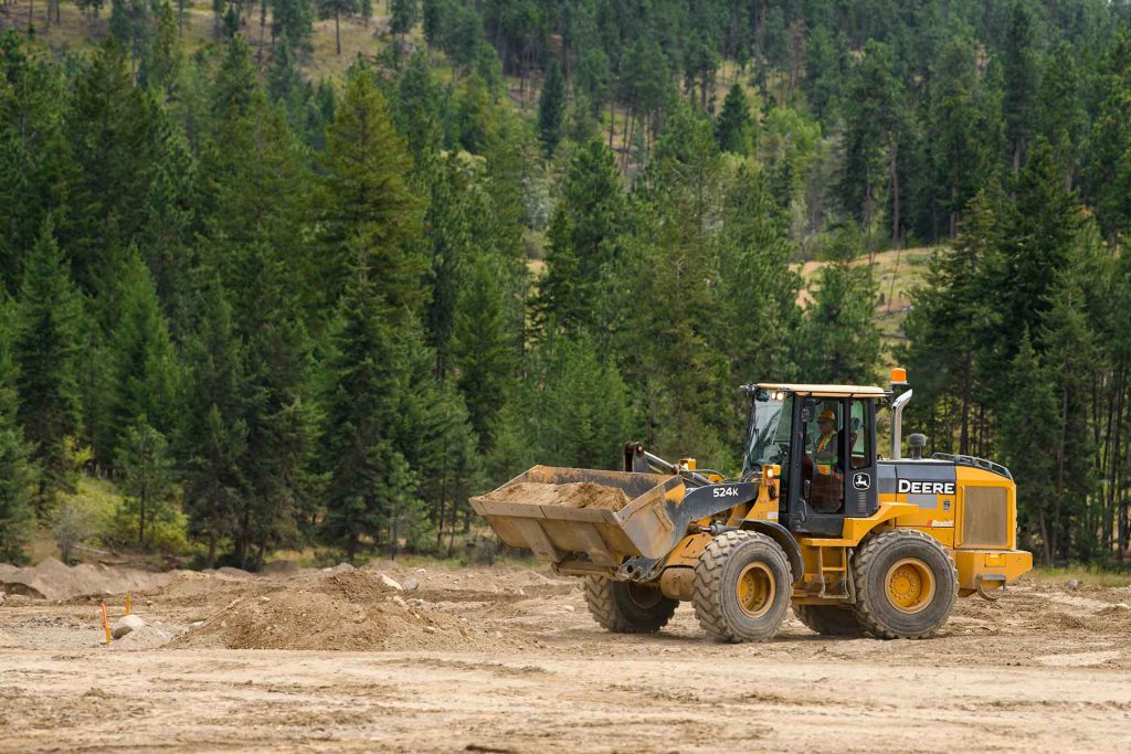 Interior Heavy Equipment school instructor operating a Loader