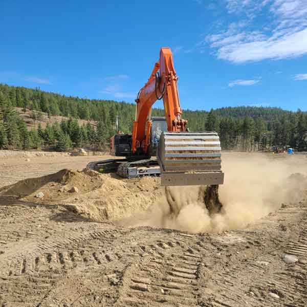 Heavy equipment operator using the Hitachi excavator