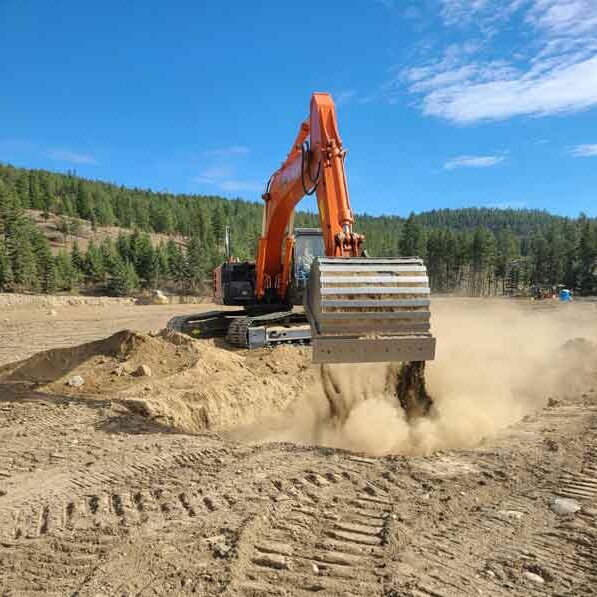 Heavy equipment operator using the Hitachi excavator